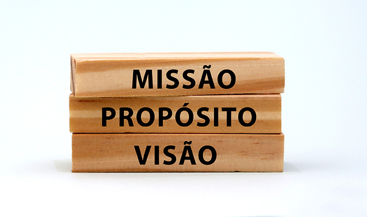 A pile of three wooden blocks on a bright background. A pile of three wooden blocks on a bright background.